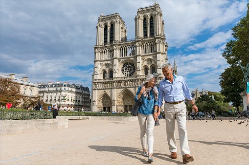 Senior couple in vacation, spending their holidays visiting the beautiful city of Paris, France