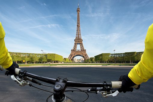 Point of view handle of a bicycle near Eiffel Tower in Paris