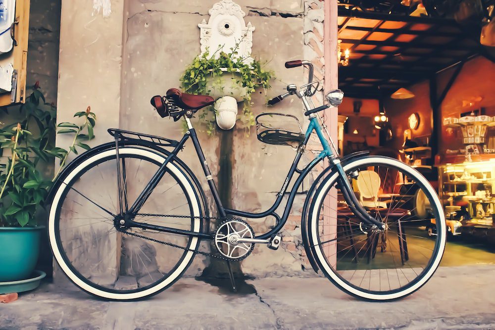 A bicycle parked outside a restaurant in Paris