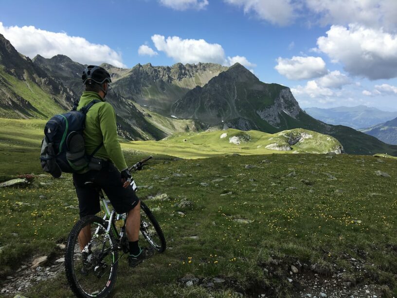 Cyclist appreciating the beautiful natural landscape ahead