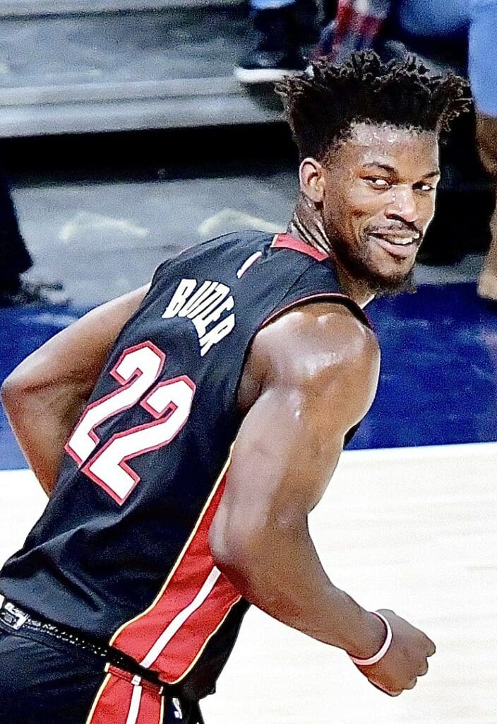 Jimmy Butler of the Miami Heat smirking while jogging