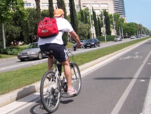 Bicycle rider on Bike path, in Barcelona.