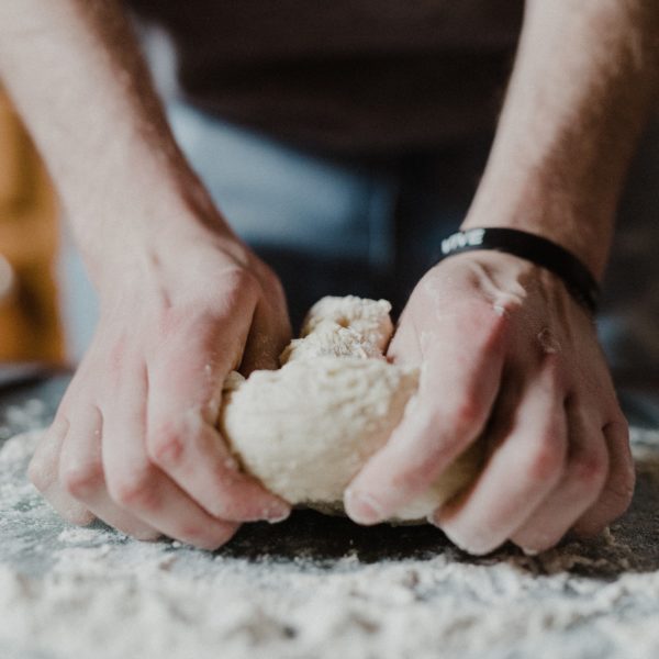 A man working on a dough by Jeremy Yap - Unsplash
