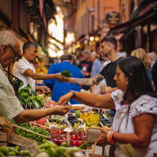 People in a market by Renate Vanaga - Unplash