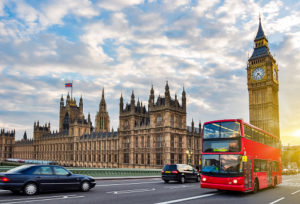 Houses of Parliament with Big Ben and double-decker bus on Westminster bridge at sunset, London, UKuble decker bus passing palace - Unsplash